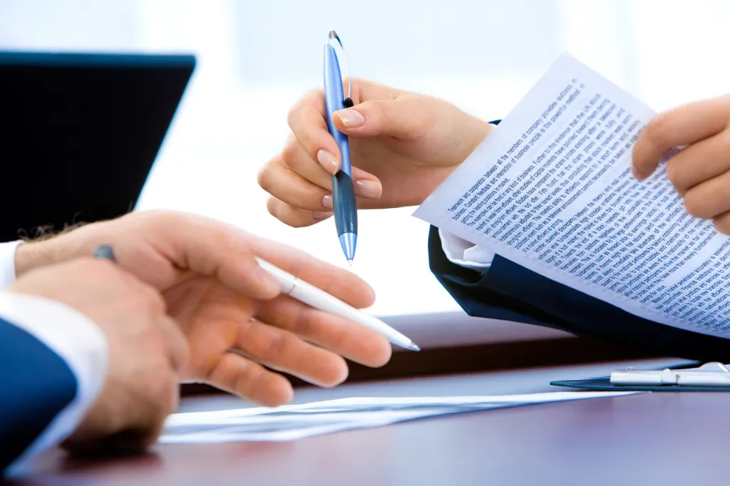 Two attorneys working on paperwork. 