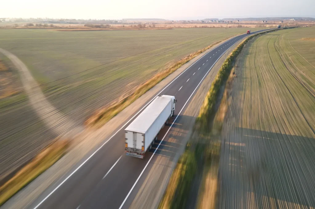 Semi-truck driving down a highway.
