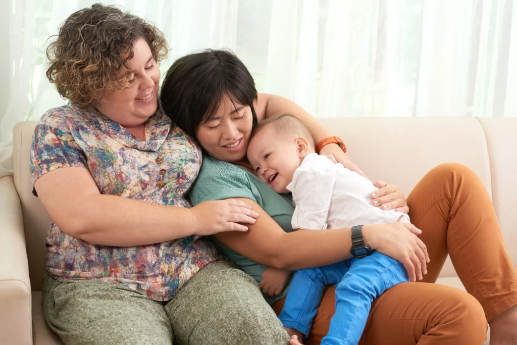 Two moms with their children.