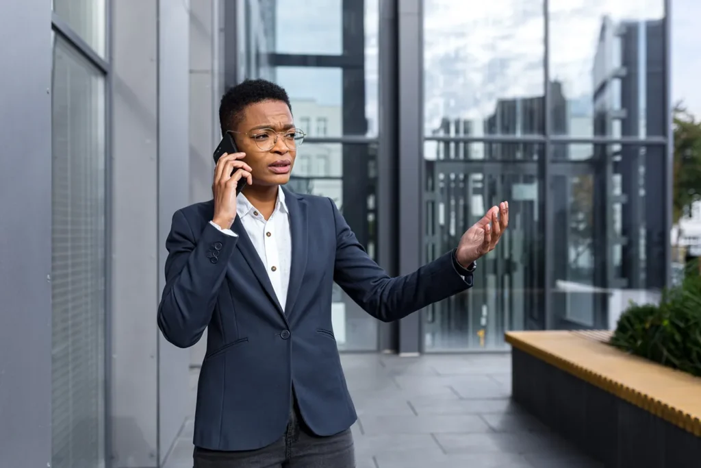 Female business woman speaking on phone.